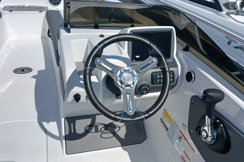 Slide: The Image of 2026 Tahoe T21 boat cockpit with steering wheel and control panel. - 8