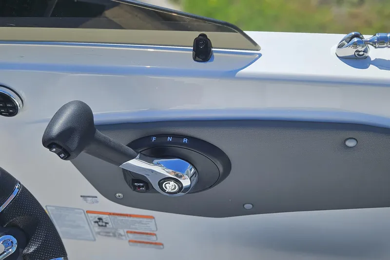 Slide: The Image of Throttle control lever on 2026 Tahoe T21 boat dashboard, featuring forward, neutral, reverse settings. - 89