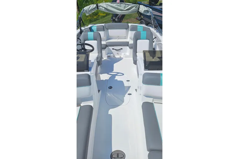 Slide: The Image of 2026 Tahoe T21 boat interior with modern seating and steering wheel. - 88