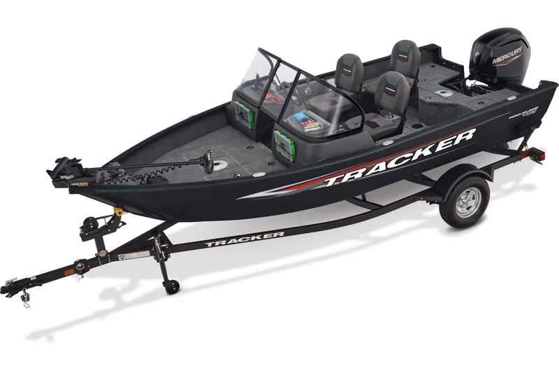 Slide: The Image of 2026 Tracker Pro Guide V-16 WT boat interior with seating and steering console. - 2