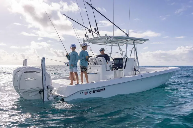 Slide: The Image of Manufacturer Provided Image: 2025 Contender 29 Bay boat with anglers fishing in open ocean. - 2