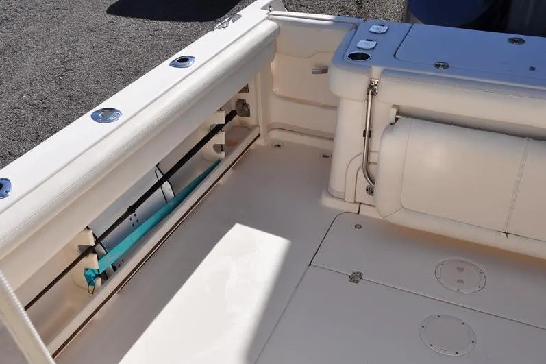 Slide: The Image of 2015 Grady-White Marlin 300 boat interior with rod storage and seating. - 10
