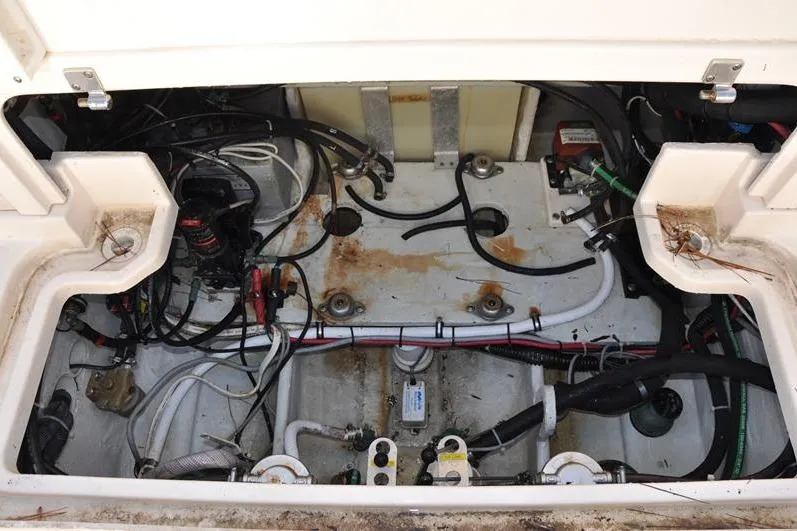 Slide: The Image of 2015 Grady-White Marlin 300 engine compartment with visible wiring and components. - 14