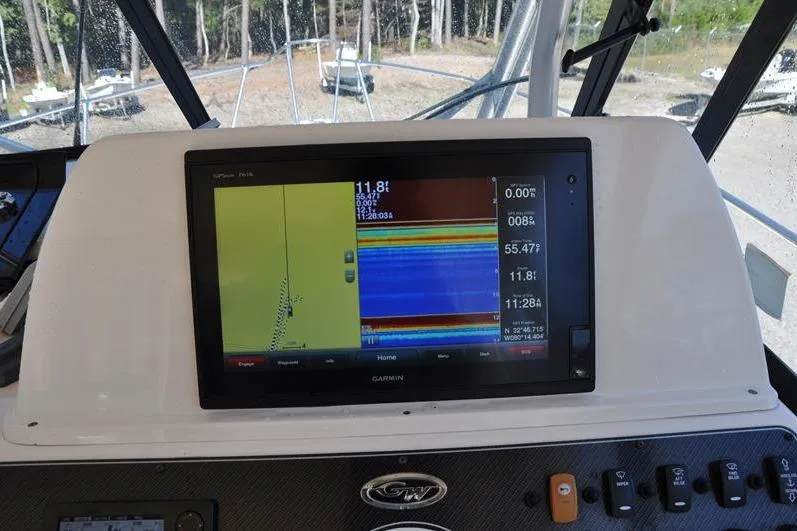 Slide: The Image of Grady-White Marlin 300 boat dashboard with Garmin navigation display, 2015 model. - 17