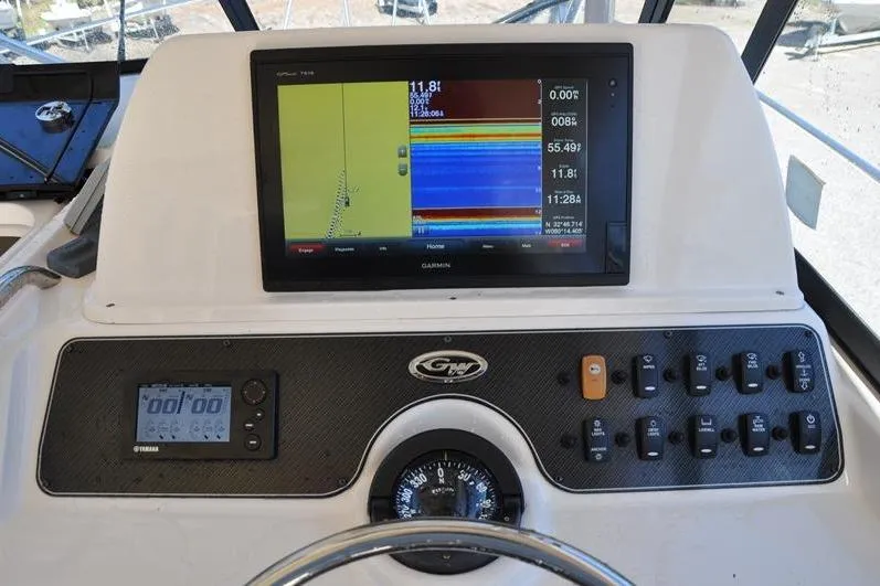 Slide: The Image of Control panel of 2015 Grady-White Marlin 300 boat with Garmin navigation display. - 18