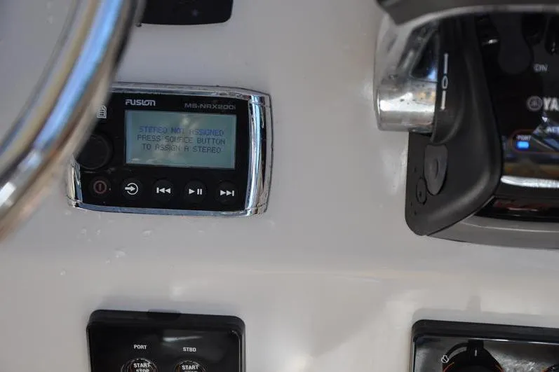 Slide: The Image of Fusion stereo system on 2015 Grady-White Marlin 300 boat dashboard. - 21