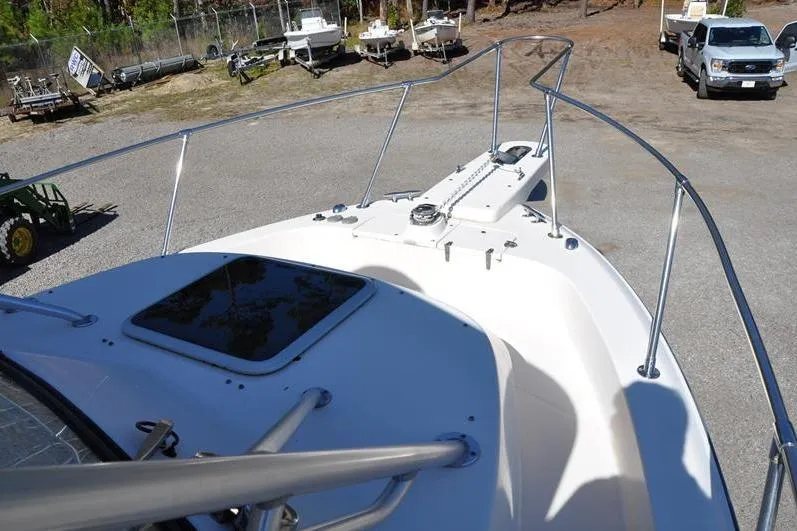 Slide: The Image of 2015 Grady-White Marlin 300 boat bow view in a parking area. - 29