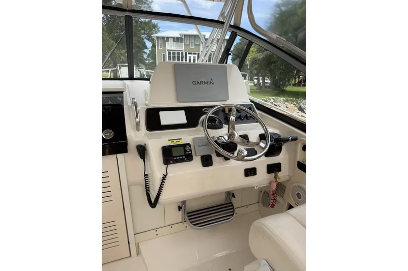 Slide: The Image of 2015 Grady-White Marlin 300 boat with dual Yamaha 300 engines on a trailer. - 3