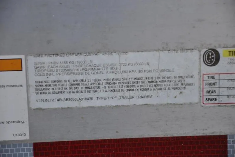 Slide: The Image of Label on a Grady-White Marlin 300, 2015, showing vehicle specifications and safety standards. - 37