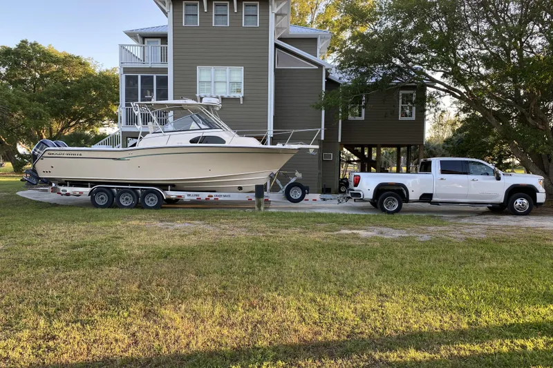 Slide: The Image of 2015 Grady-White Marlin 300 boat deck, spacious and well-equipped for fishing. - 9