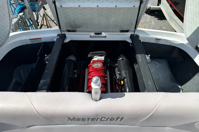 Slide: The Image of 2007 MasterCraft X-15 boat engine compartment with red engine and open hatch. - 11