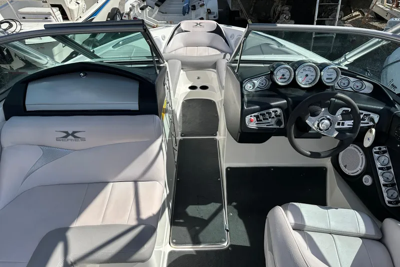 Slide: The Image of 2007 MasterCraft X-15 boat interior with steering wheel and dashboard controls. - 4