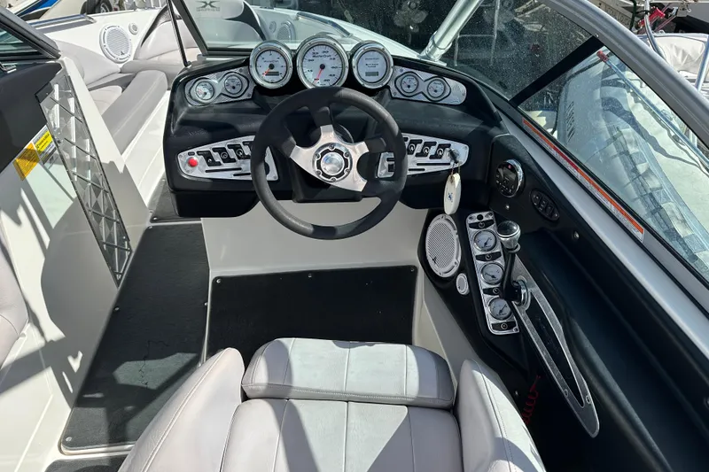 Slide: The Image of 2007 MasterCraft X-15 boat dashboard with steering wheel and gauges. - 5