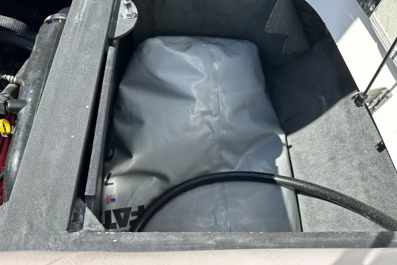 Slide: The Image of 2007 MasterCraft X-15 ballast compartment with gray bag and hose. - 9