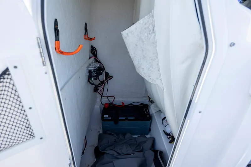 Slide: The Image of Interior storage of 2019 Sea Hunt BX 22 BR boat with equipment and wiring. - 15