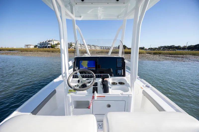 Slide: The Image of 2019 Sea Hunt BX 22 BR boat console with steering wheel and navigation system. - 18