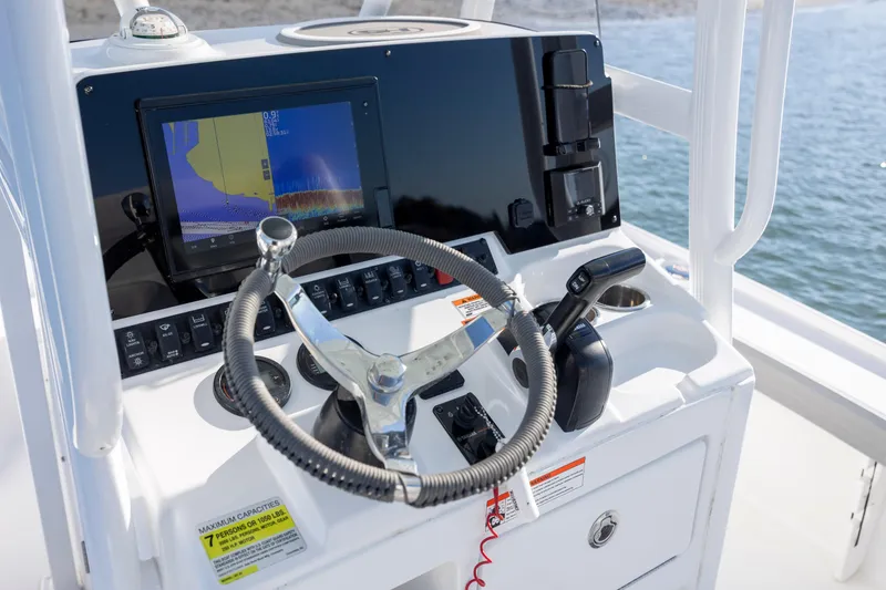 Slide: The Image of 2019 Sea Hunt BX 22 BR boat console with steering wheel and navigation display. - 19