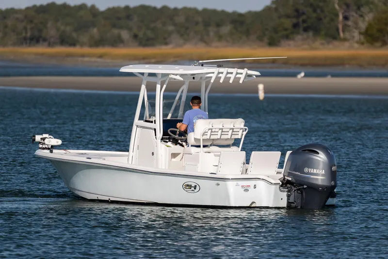 Slide: The Image of 2019 Sea Hunt BX 22 BR boat cruising on calm waters with Yamaha engine. - 2