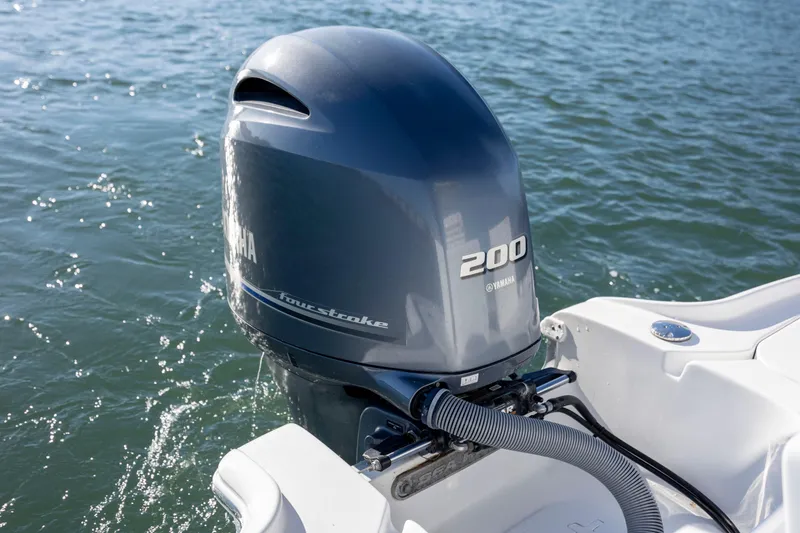 Slide: The Image of 2019 Sea Hunt BX 22 BR with Yamaha 200 four-stroke engine on water. - 22