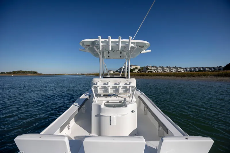 Slide: The Image of 2019 Sea Hunt BX 22 BR boat on calm water with clear blue sky. - 23
