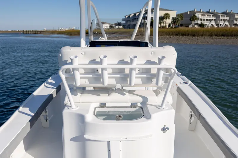 Slide: The Image of 2019 Sea Hunt BX 22 BR boat on water, featuring rod holders and a livewell. - 24