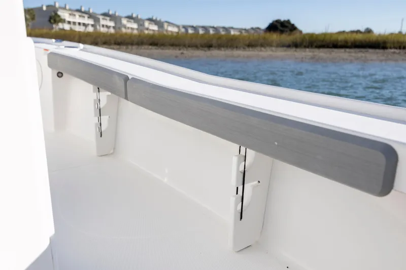 Slide: The Image of 2019 Sea Hunt BX 22 BR boat interior with coastal background. - 25