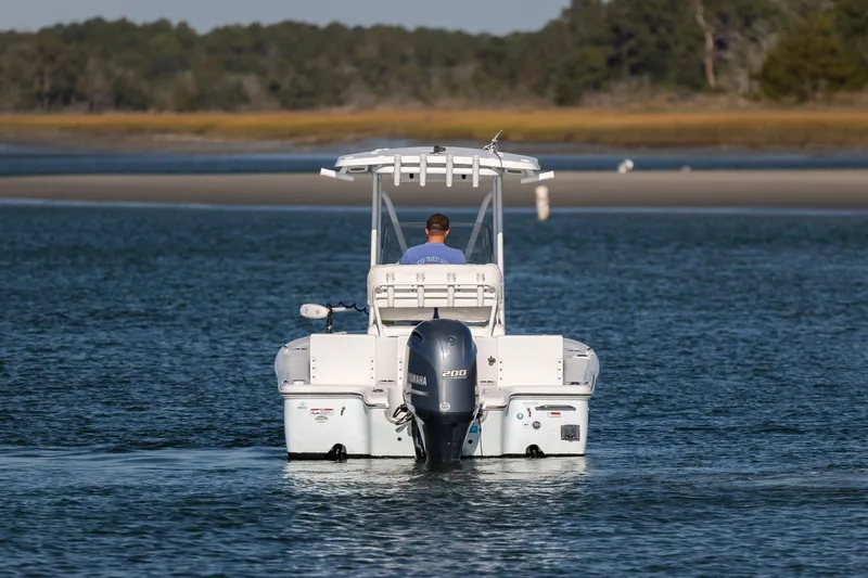 Slide: The Image of 2019 Sea Hunt BX 22 BR boat cruising on a calm waterway. - 3