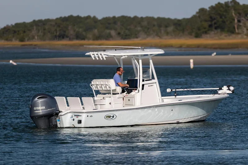 Slide: The Image of 2019 Sea Hunt BX 22 BR boat cruising on calm waters with Yamaha engine. - 4