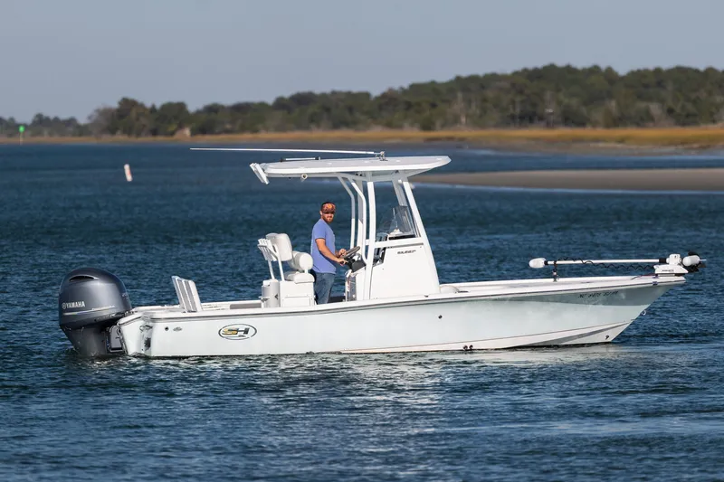 Slide: The Image of 2019 Sea Hunt BX 22 BR boat cruising on a calm waterway. - 5