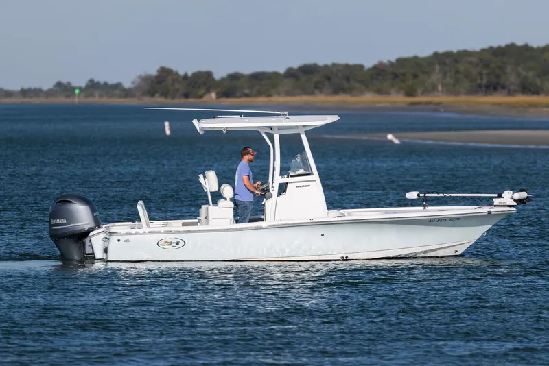 Slide: The Image of 2019 Sea Hunt BX 22 BR boat cruising on calm waters with a Yamaha engine. - 6
