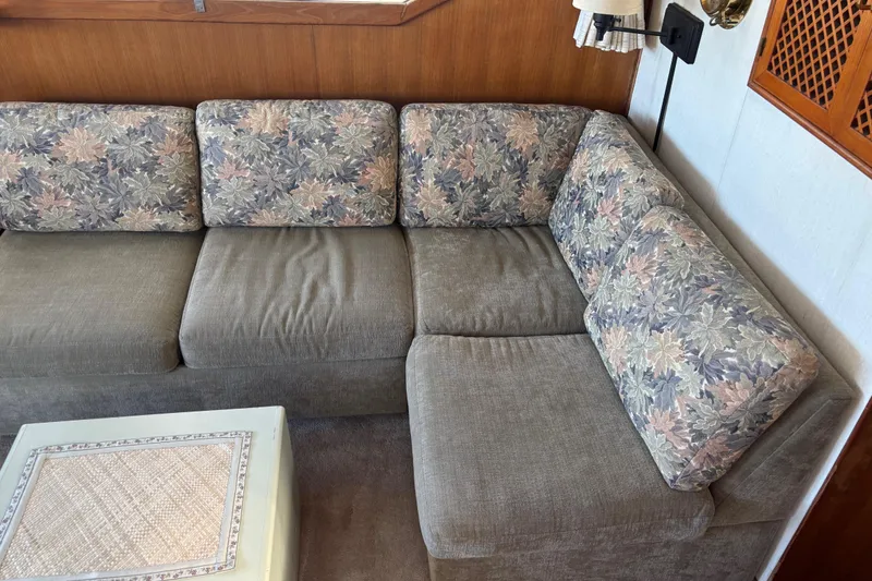Slide: The Image of Vintage 1986 Ponderosa boat interior with floral-patterned cushions and wooden accents. - 20
