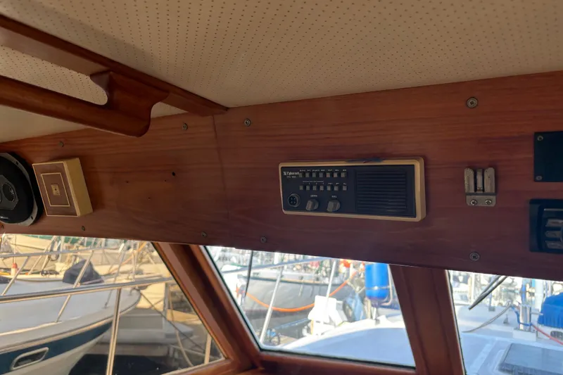 Slide: The Image of Interior of a 1986 Ponderosa boat showing vintage radio and speaker system. - 22
