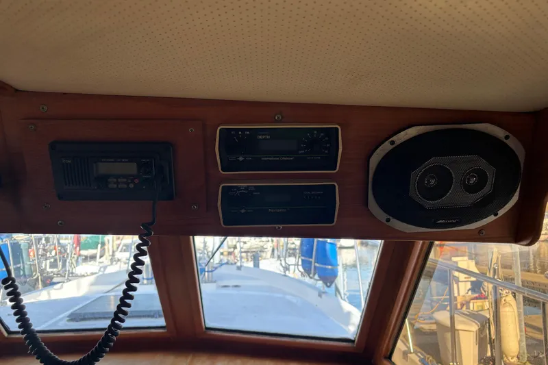 Slide: The Image of 1986 Ponderosa boat dashboard with radio, depth gauges, and speaker. - 24
