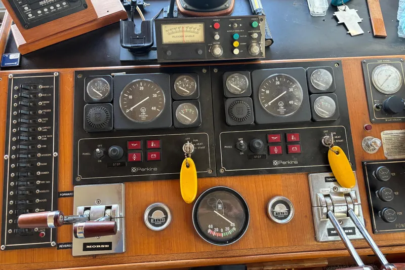 Slide: The Image of Control panel of a 1986 Ponderosa boat with gauges and switches. - 25