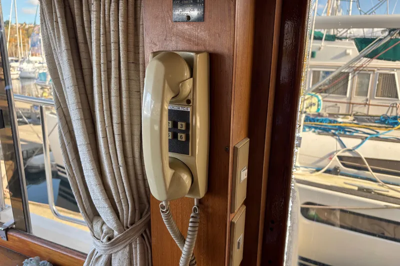 Slide: The Image of Vintage 1986 Ponderosa boat intercom phone with marina view. - 29