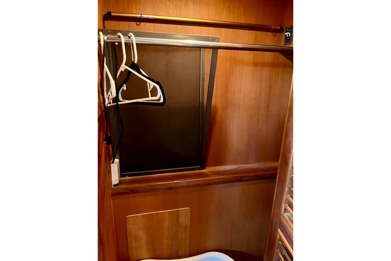 Slide: The Image of Wooden closet interior with hangers, CHB Ponderosa 1986 model. - 47