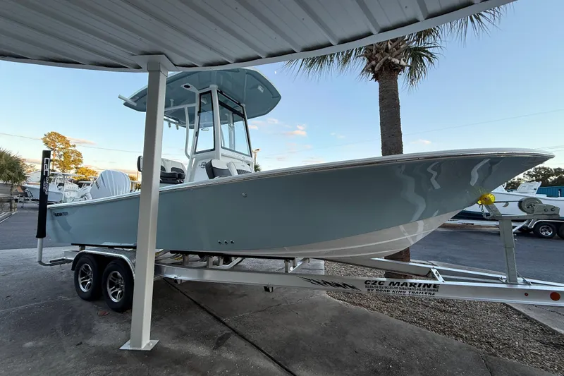The Image of 2026 Tidewater 2300 Carolina Bay boat on trailer, side view, outdoors. - 0
