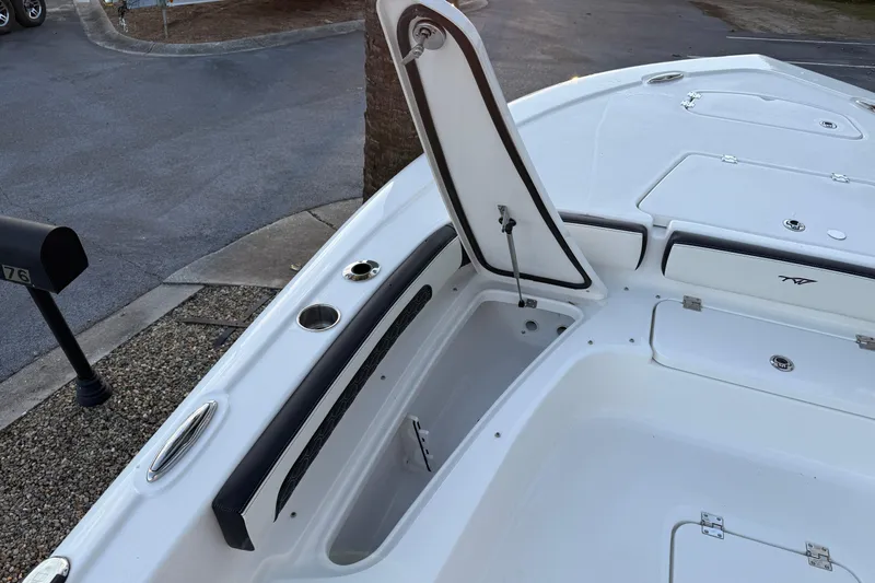 Slide: The Image of 2026 Tidewater 2300 Carolina Bay boat with Yamaha engine, featuring rear seating and storage. - 13
