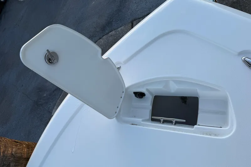 Slide: The Image of 2026 Tidewater 2300 Carolina Bay boat interior with open storage compartment. - 15