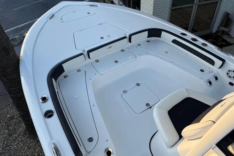 Slide: The Image of Open storage compartment on 2026 Tidewater 2300 Carolina Bay boat. - 16