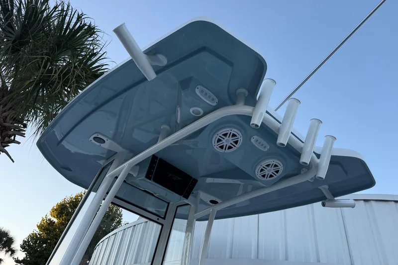 Slide: The Image of 2026 Tidewater 2300 Carolina Bay boat on trailer, sunny day, outdoor display. - 2