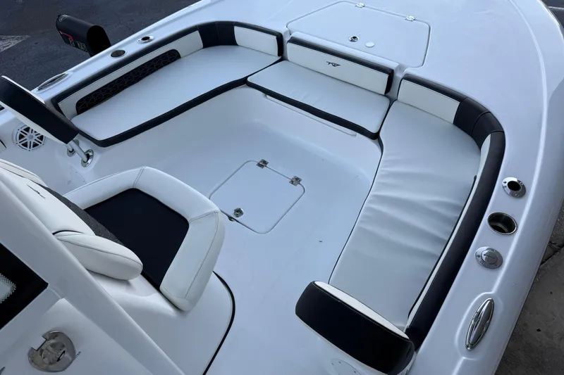 Slide: The Image of 2026 Tidewater 2300 Carolina Bay boat interior with dual seats and Yamaha engine. - 6