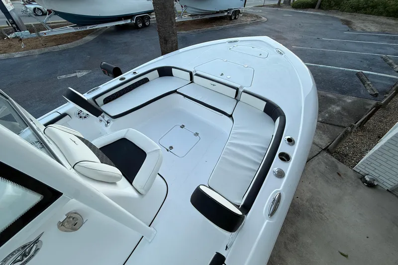 Slide: The Image of 2026 Tidewater 2300 Carolina Bay boat interior with seating and console. - 7