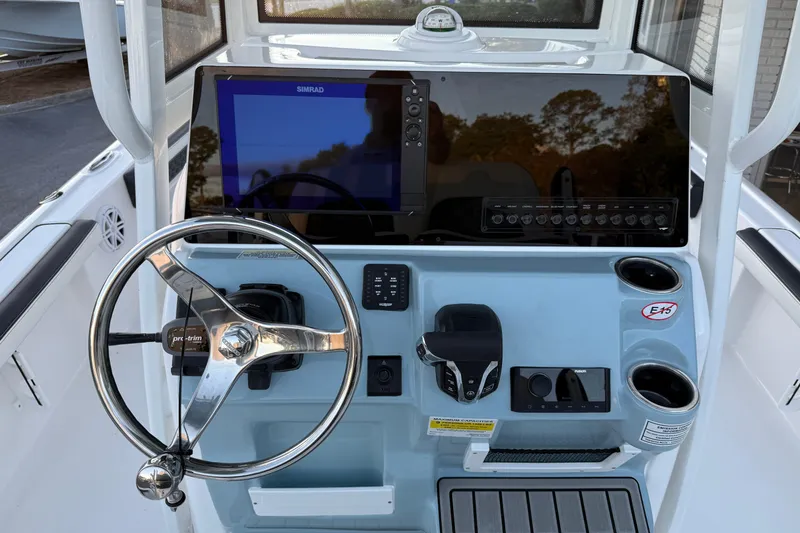 Slide: The Image of 2026 Tidewater 2300 Carolina Bay boat interior with seating and storage compartments. - 9