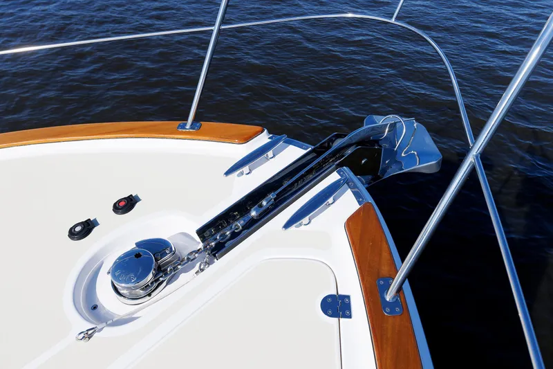 Slide: The Image of Bow of 2019 Grand Banks 44 Eastbay SX yacht with anchor and railing. - 18