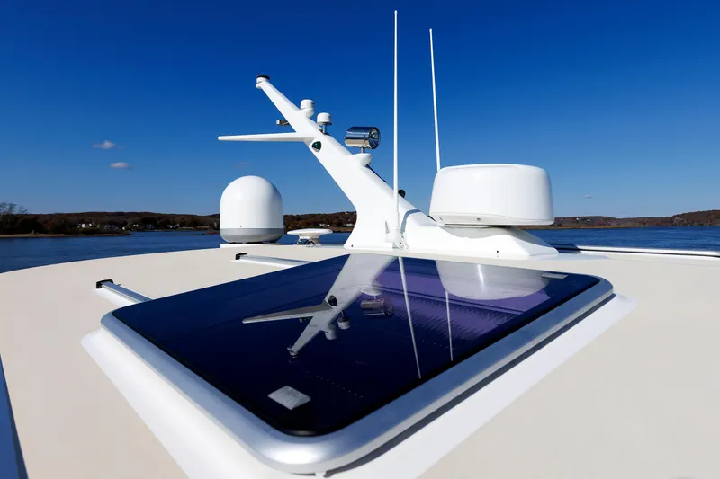 Slide: The Image of 2019 Grand Banks 44 Eastbay SX yacht with radar and navigation equipment on deck. - 19