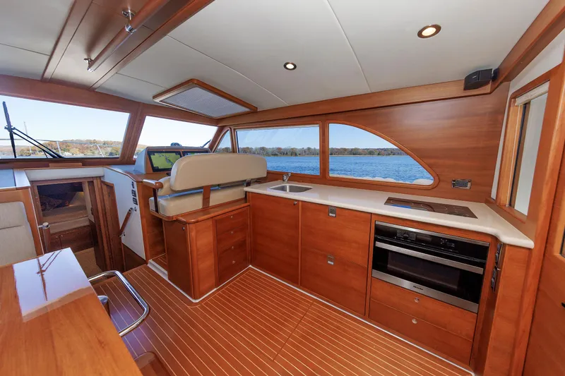 Slide: The Image of Luxurious interior of 2019 Grand Banks 44 Eastbay SX yacht with wood finish and modern amenities. - 3