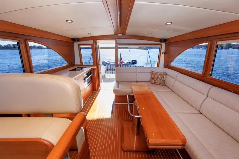 Slide: The Image of Luxurious interior of 2019 Grand Banks 44 Eastbay SX yacht with elegant wood finishes. - 32