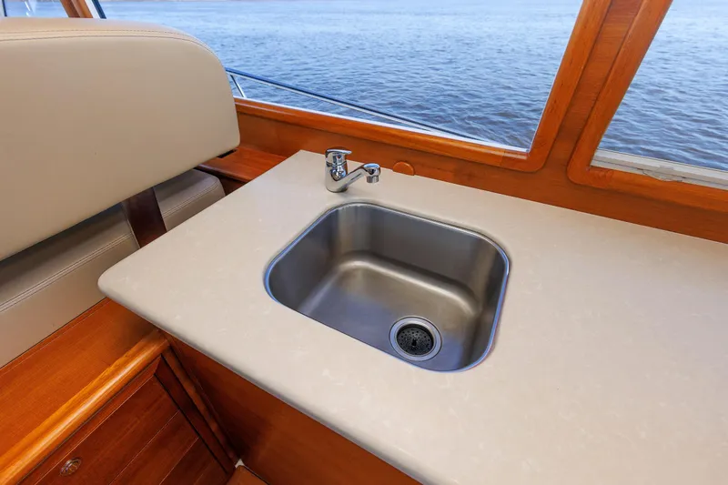 Slide: The Image of Stainless steel sink on 2019 Grand Banks 44 Eastbay SX yacht with ocean view. - 36