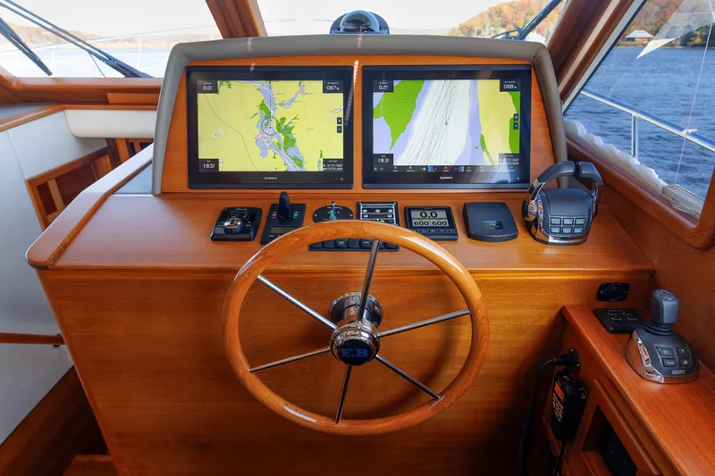 Slide: The Image of Helm of 2019 Grand Banks 44 Eastbay SX with navigation screens and controls. - 40